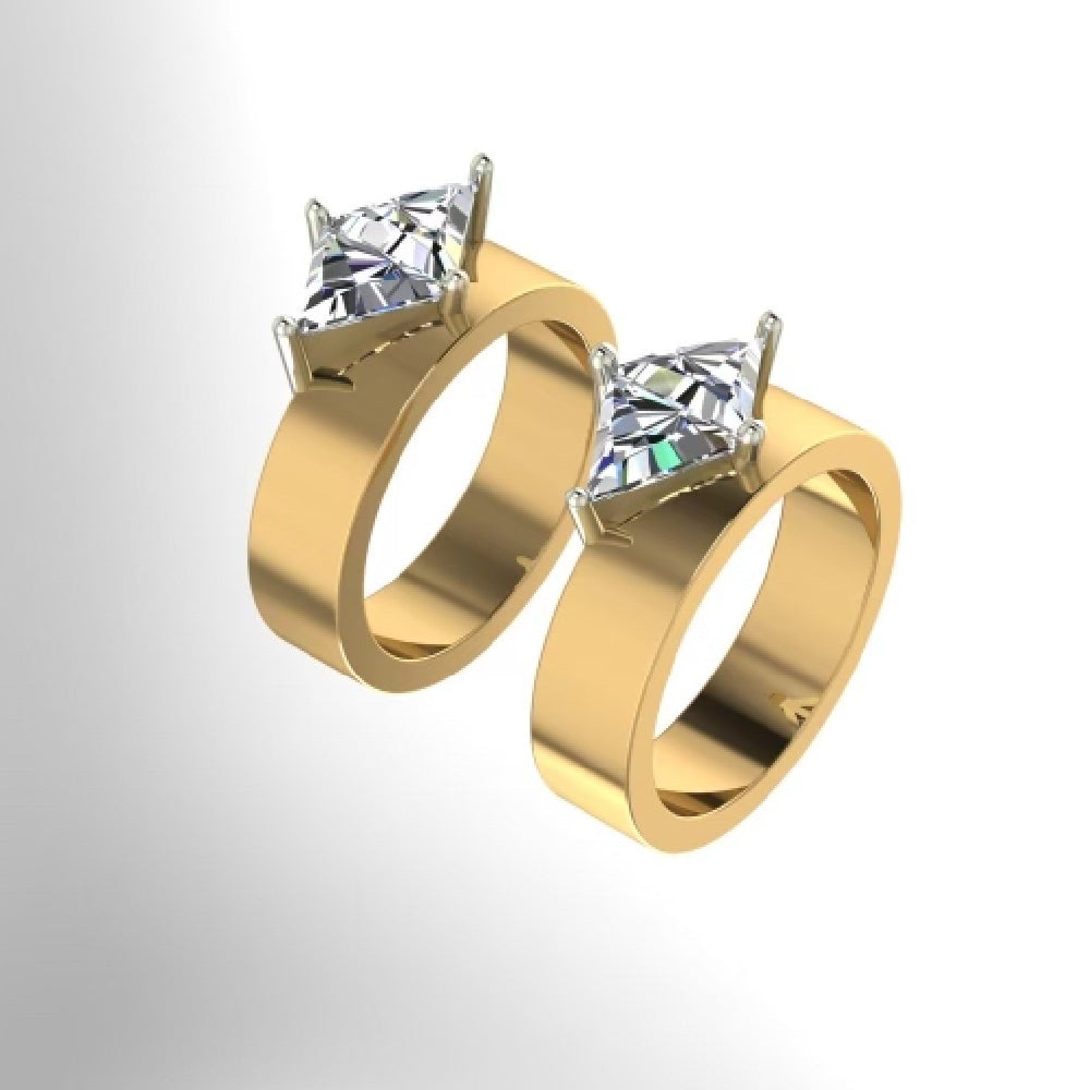Two gold rings with large princess-cut diamonds set in four-prong silver mounts.