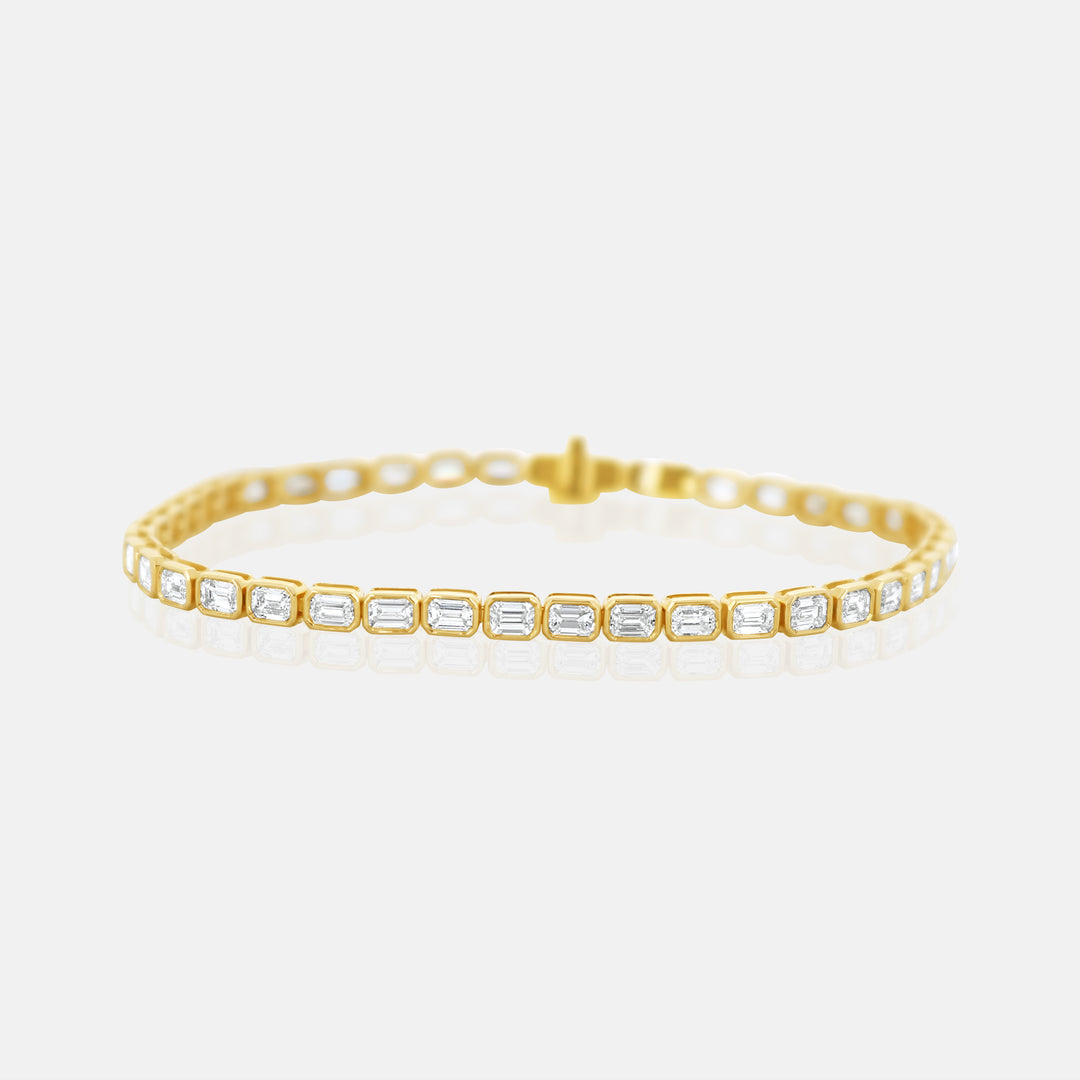 Emerald Cut Bezel Set Tennis Bracelet in 14 Karat Yellow Gold with 5.26 Carats of Diamonds