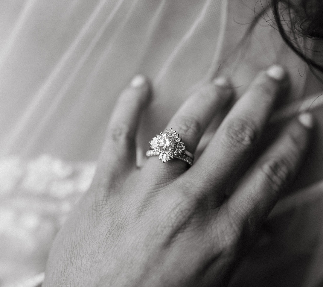 Ballerina diamond engagement ring on bride's hand.