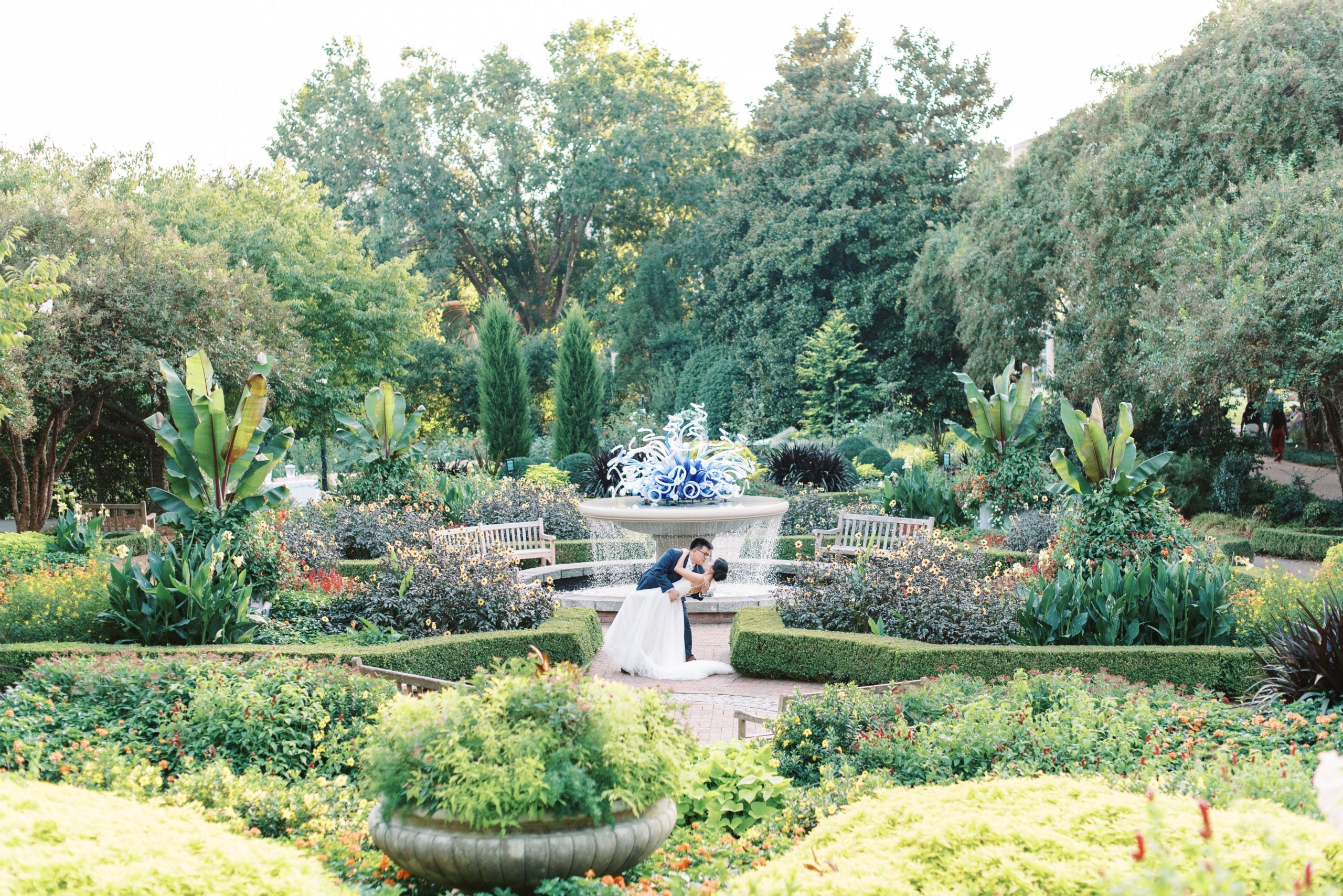 Bride and groom share a kiss at Atlanta Botanical Garden.
