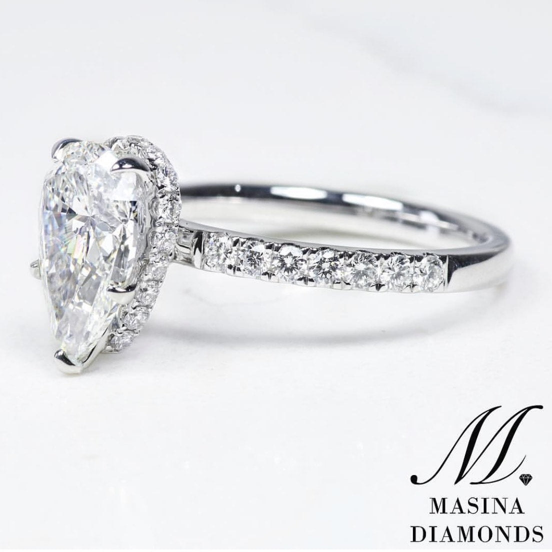 Pear cut diamond ring, white gold.