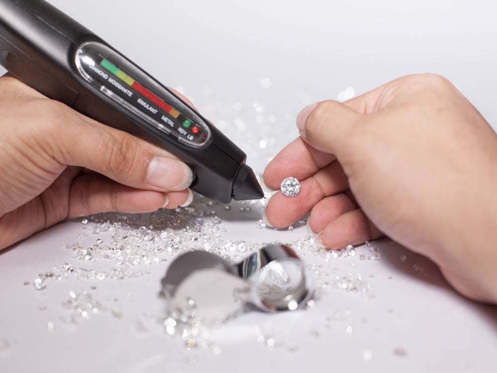 Lab diamond being tested with a diamond tester