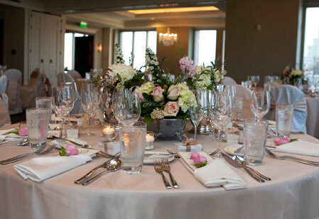 Commerce Club wedding table setting with floral centerpiece.