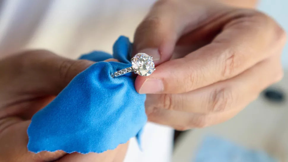 Cleaning oval diamond wedding ring with soft cloth