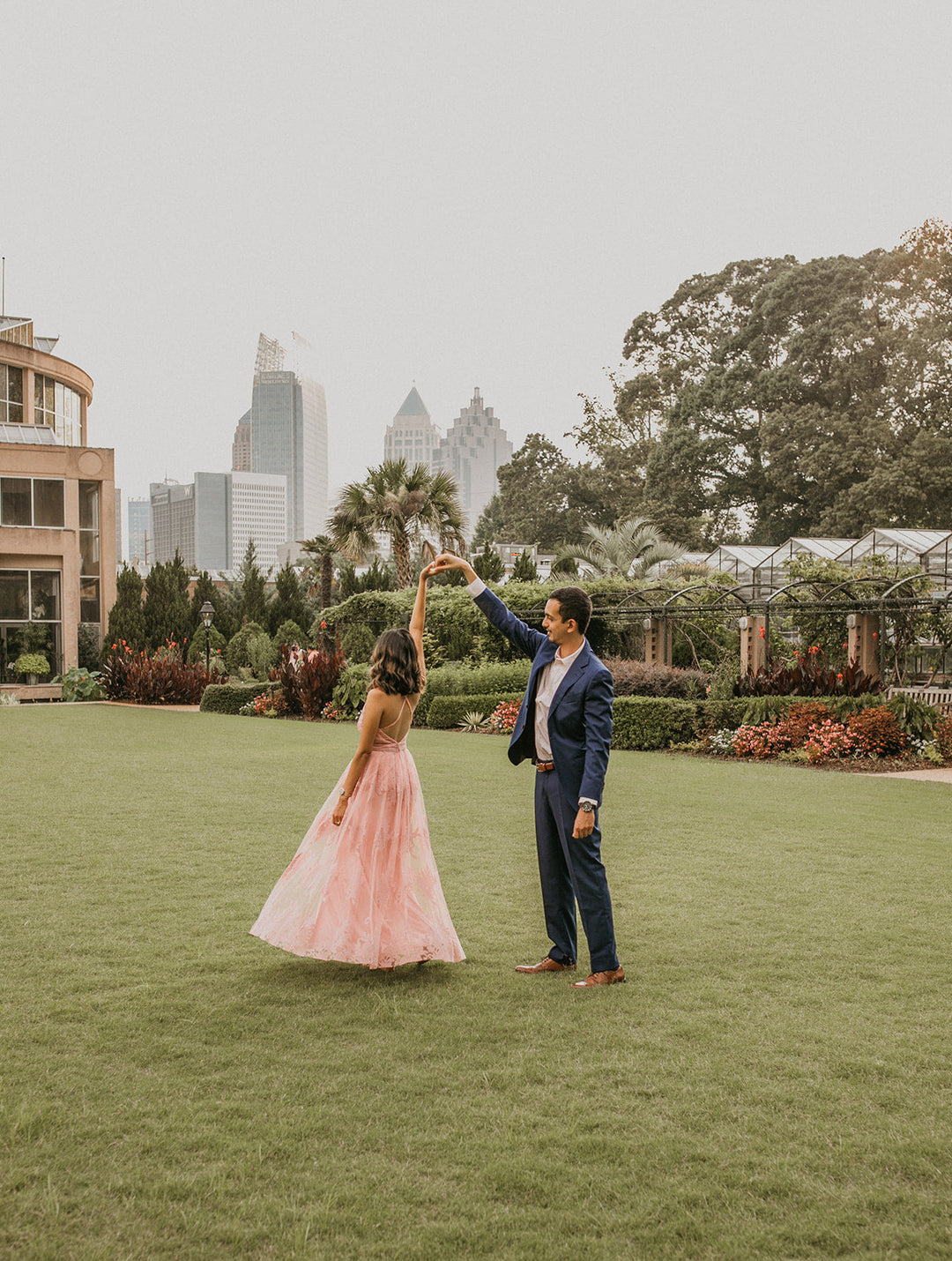 Masina Diamonds: Couple dancing, planning engagement ring in Atlanta.