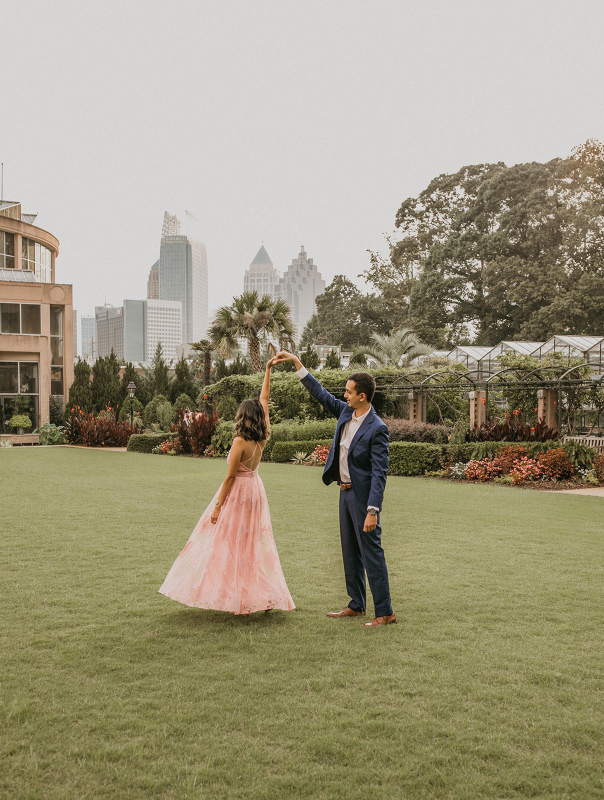 Masina Diamonds: Couple dancing, planning engagement ring in Atlanta.