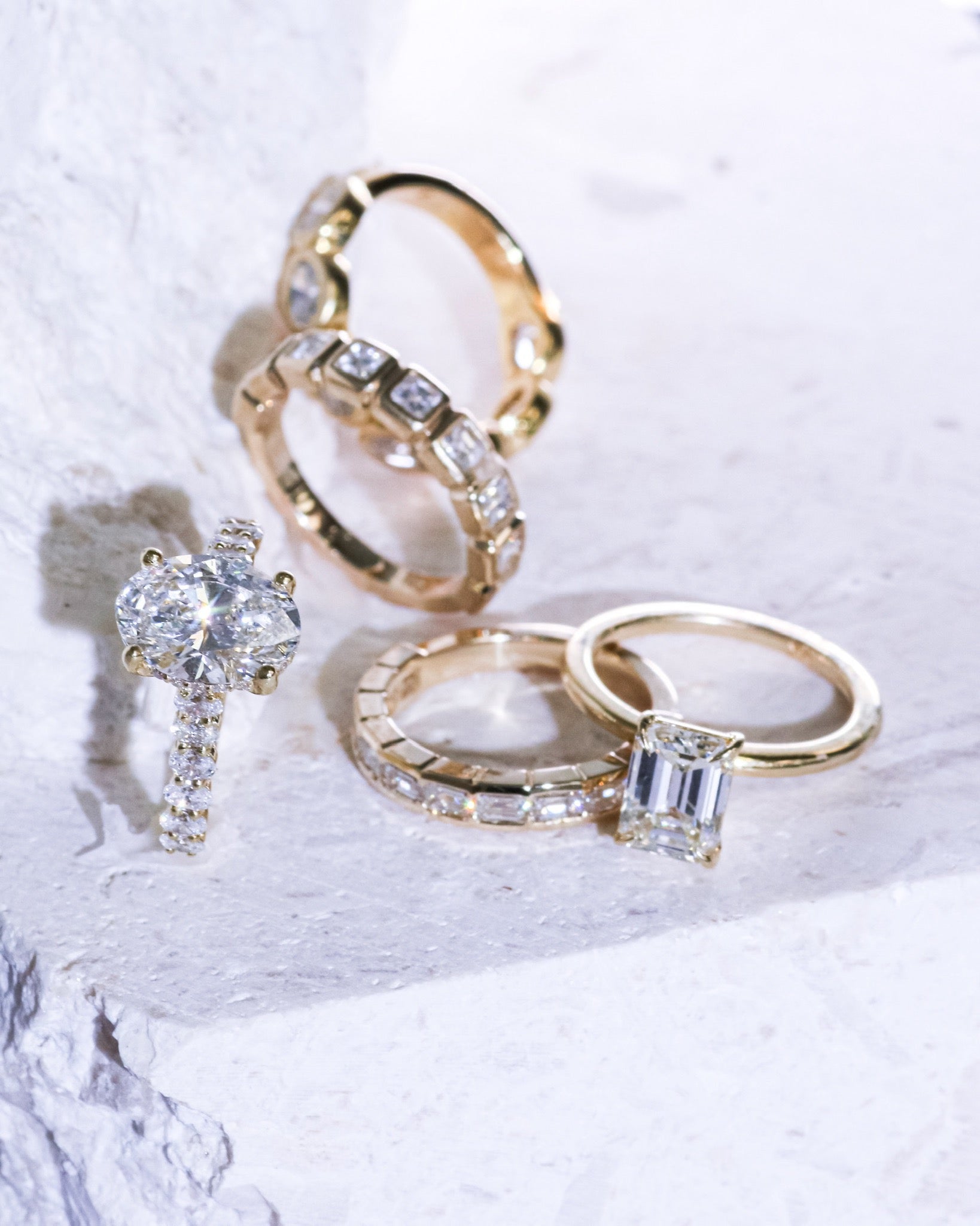 Masina Diamonds engagement rings in gold with various diamond cuts.