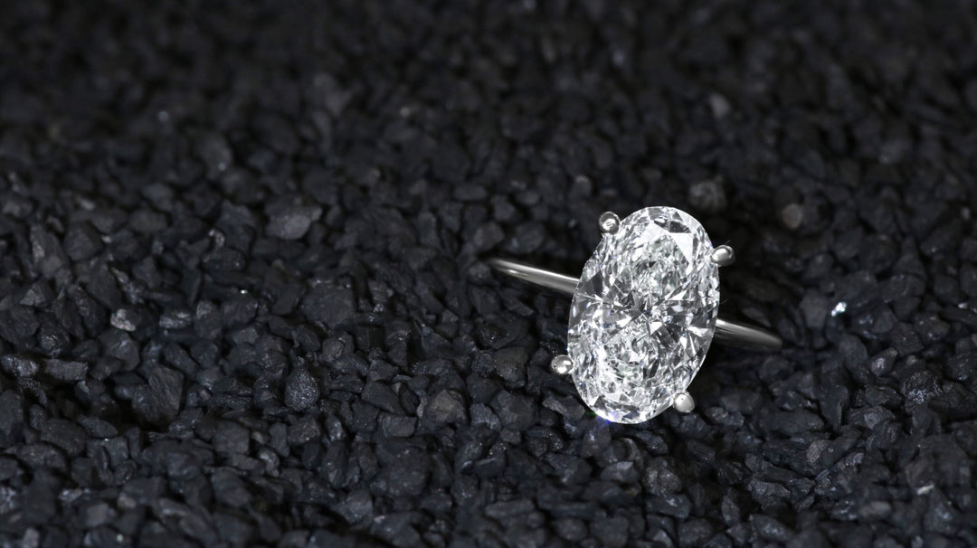 White gold ring with oval diamond.