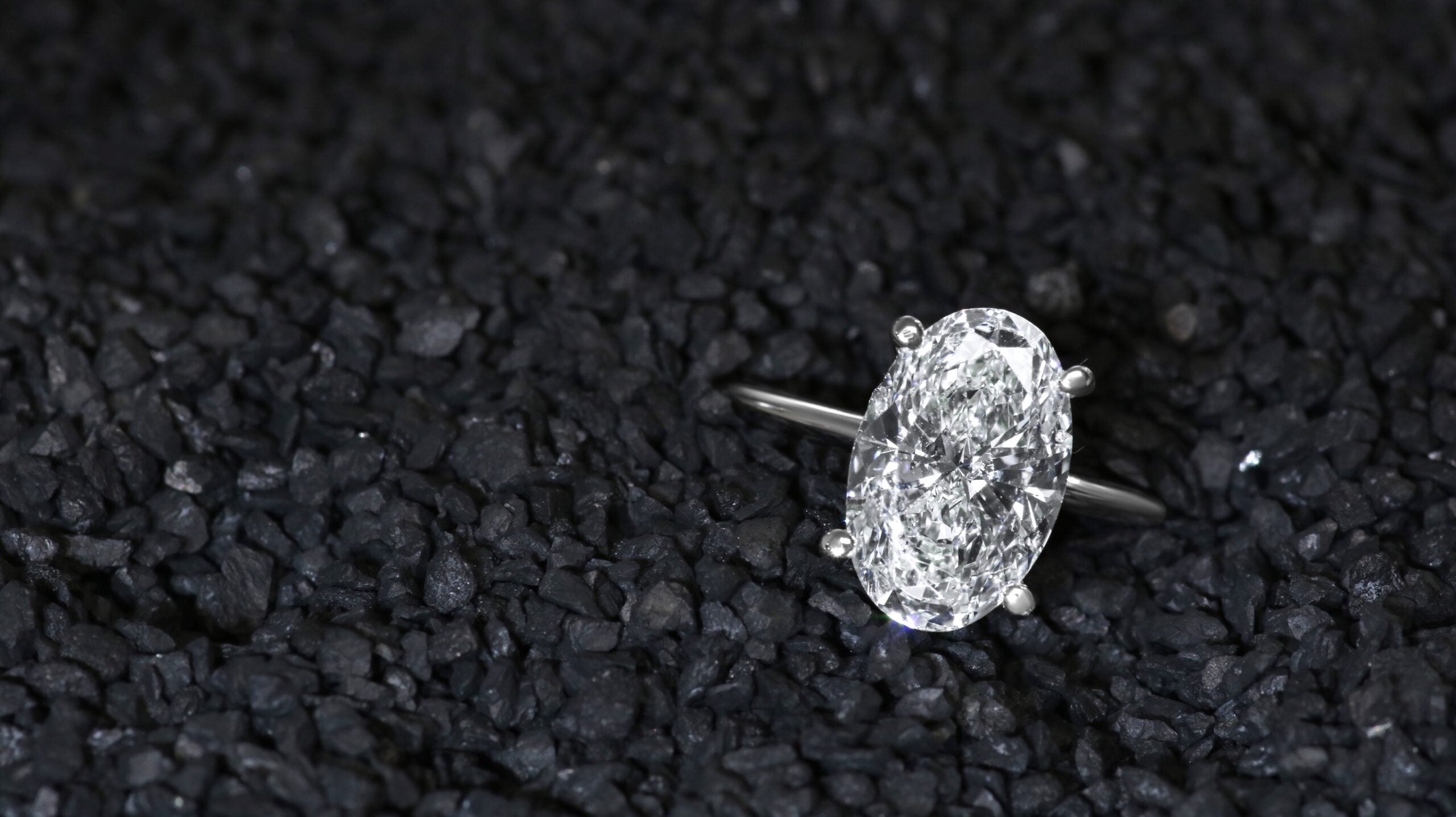 White gold ring with oval diamond.