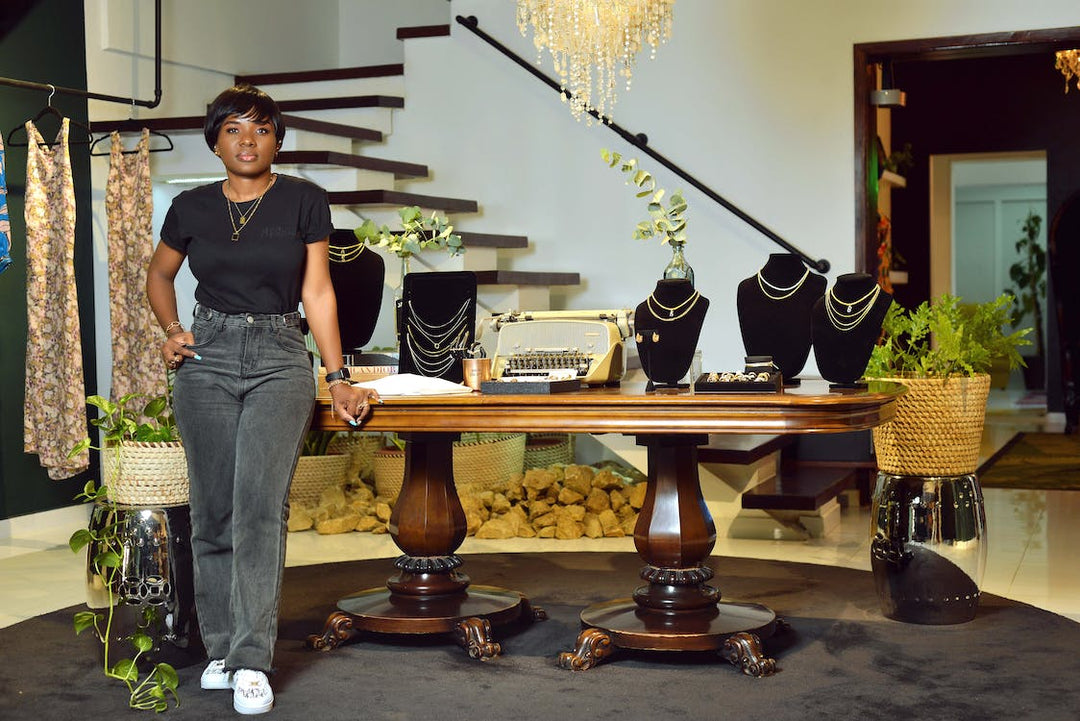 Masina showroom display of layered gold necklaces, rings, and bracelets for 2023 jewelry trends.