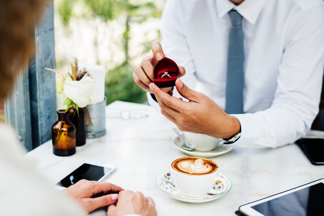 Man proposes with engagement ring; do men wear engagement rings?