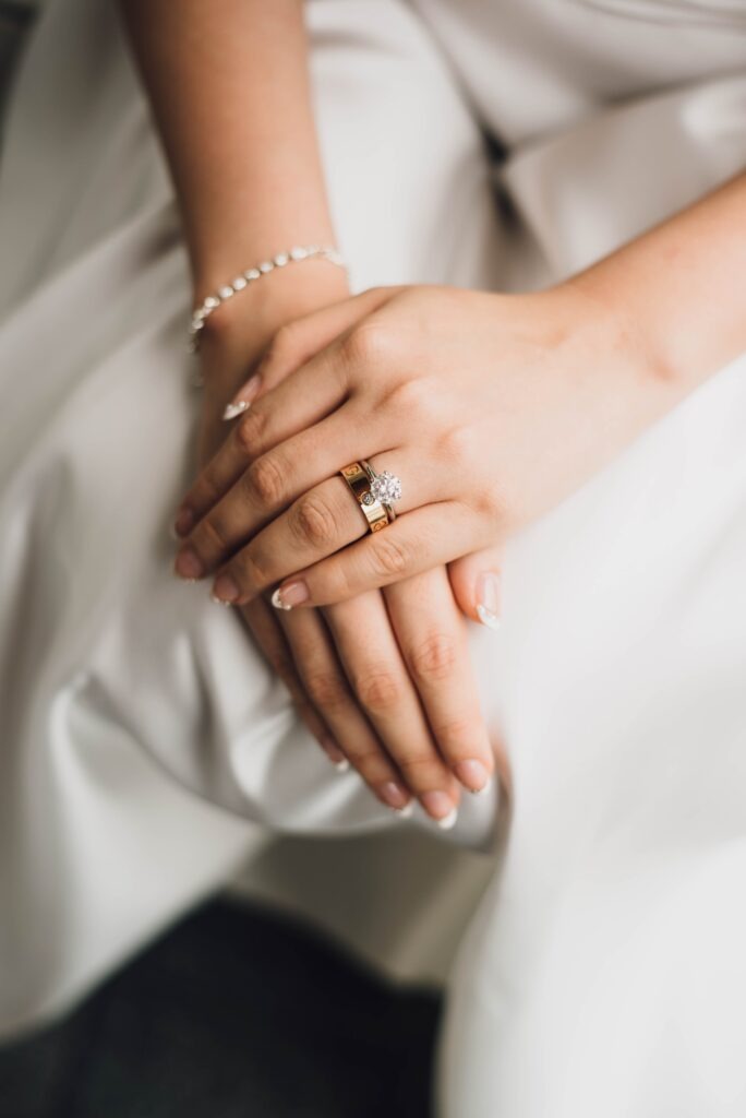Bridal hands with diamond wedding ring