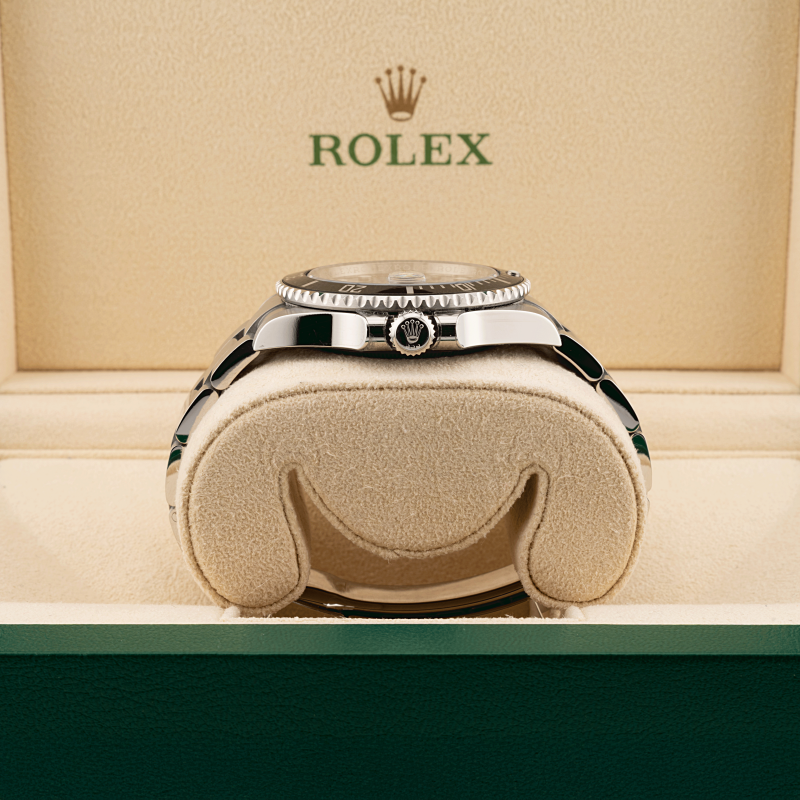 Rolex submariner watch in a rolex box with the Rolex logo above