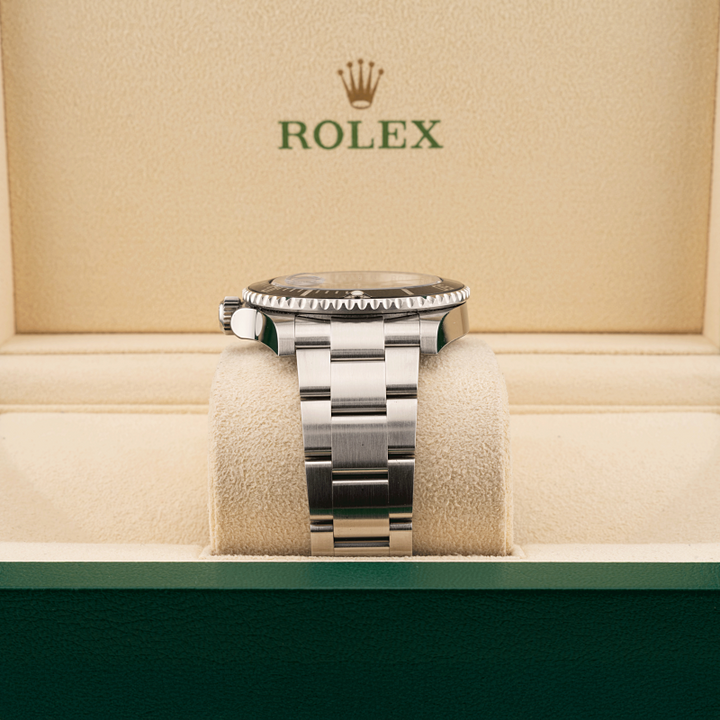 Rolex submariner watch on a cushion with a beige background