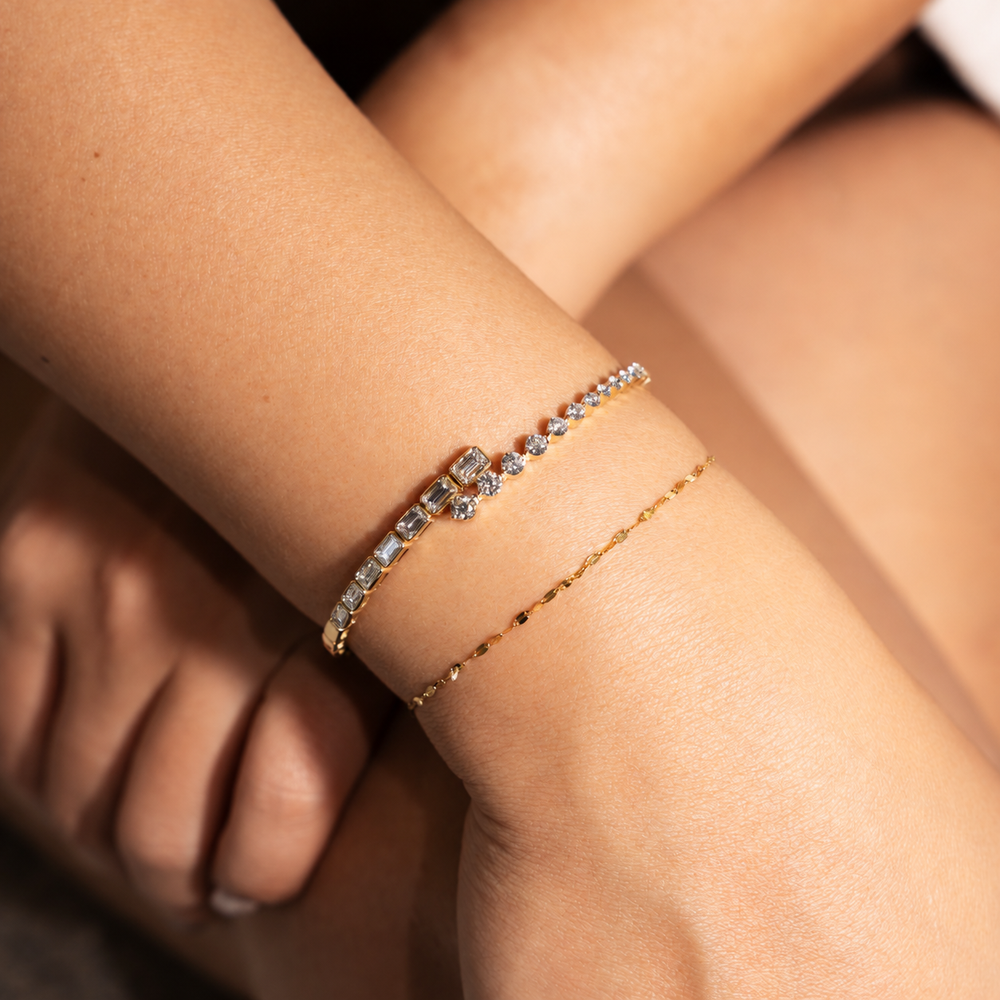 Yellow gold open cuff diamond bezel bracelet with emerald and round diamonds