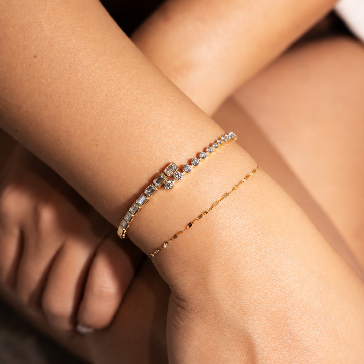 Yellow gold open cuff diamond bezel bracelet with emerald and round diamonds