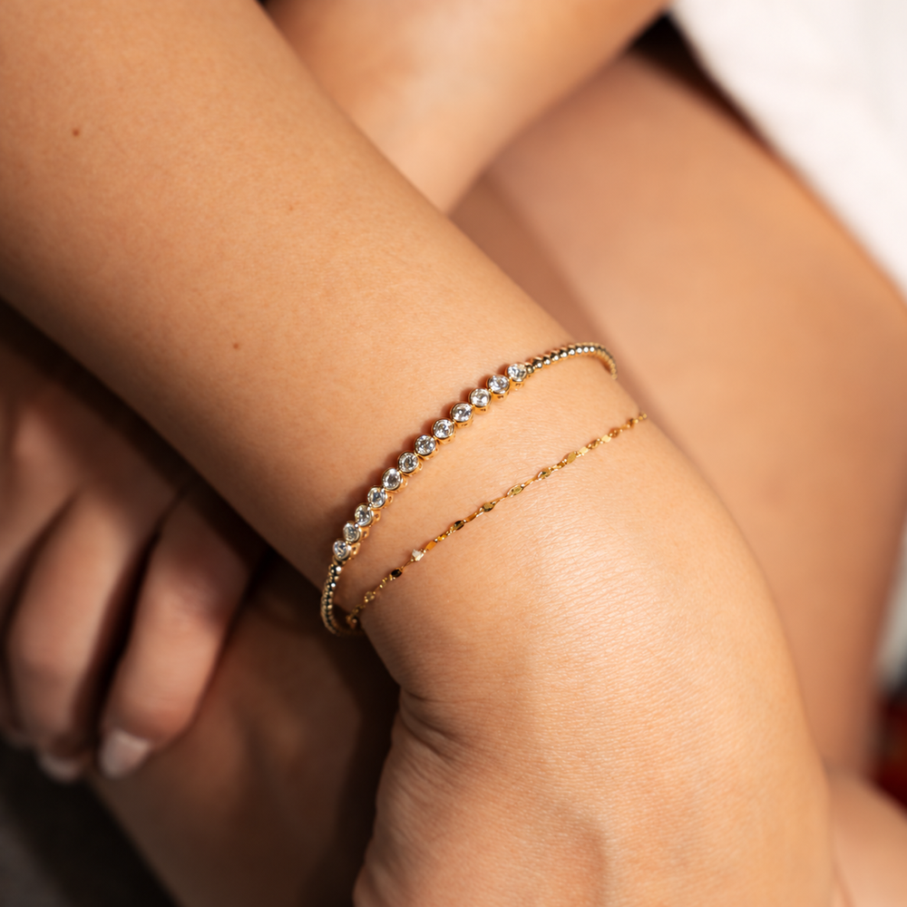 Diamond bezel set beaded bangle in 14K yellow gold with .98 carat of diamonds
