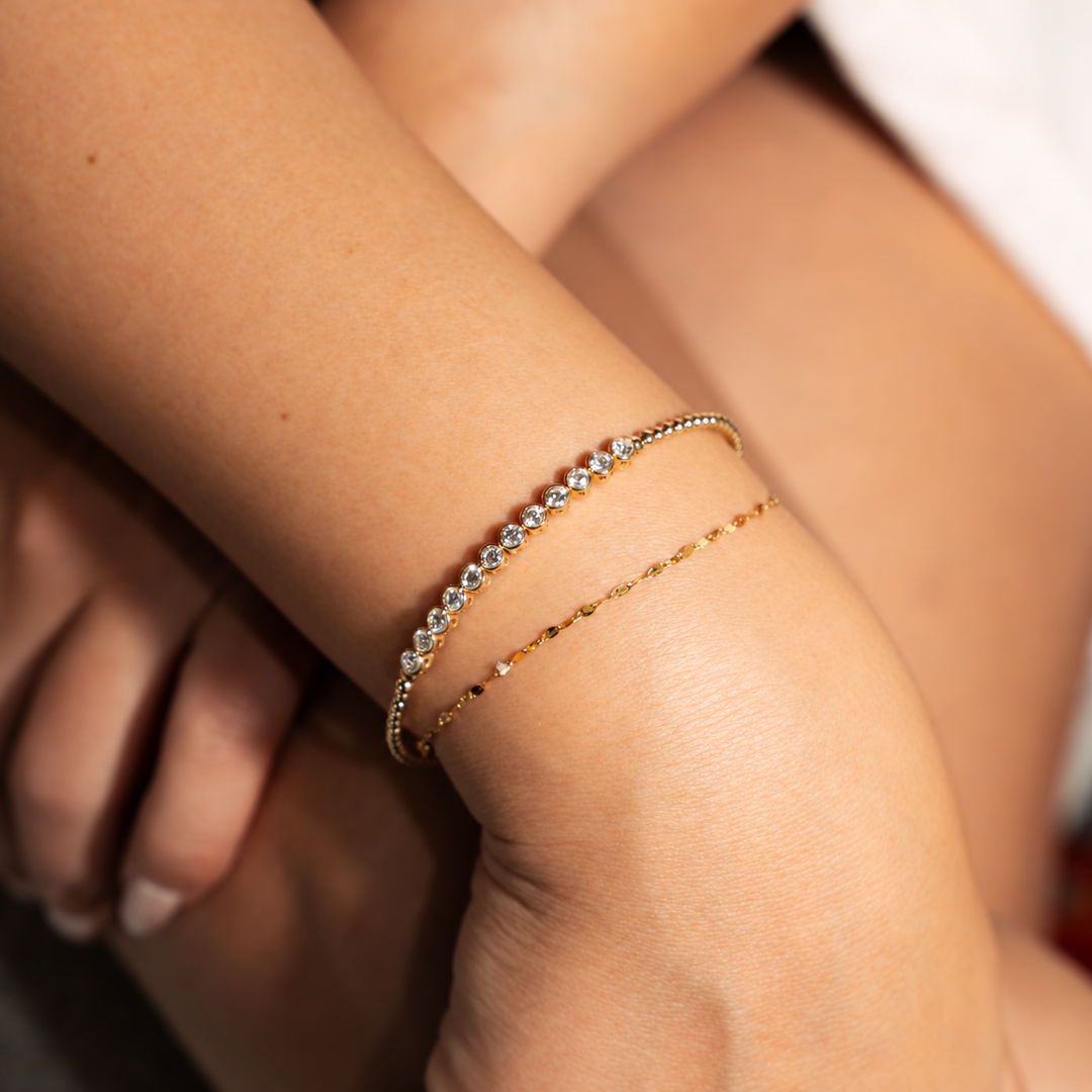 Diamond bezel set beaded bangle in 14K yellow gold with .98 carat of diamonds