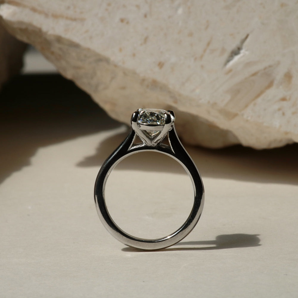 Cathedral oval diamond engagement ring