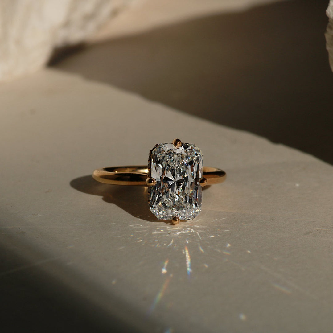 Radiant cut compass prong engagement ring in yellow gold