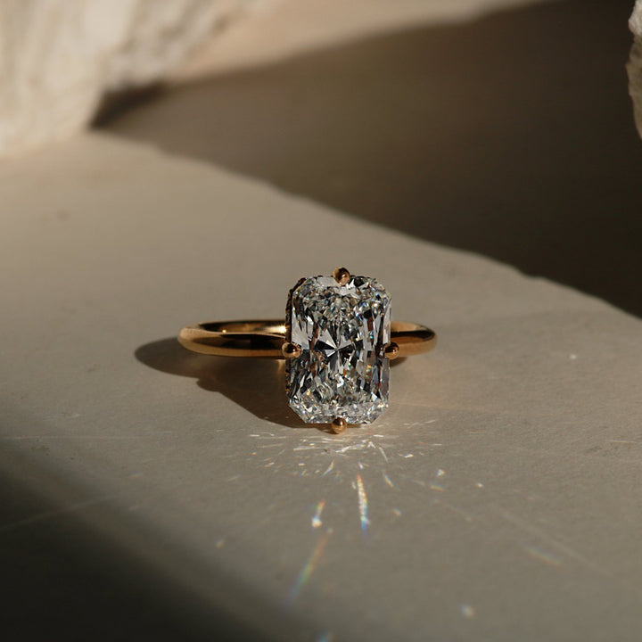 Radiant cut compass prong engagement ring in yellow gold