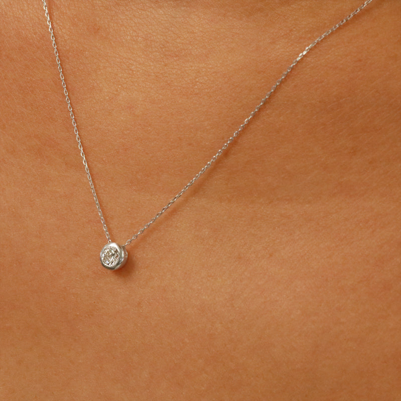 Minimalist Chic: 18K White Gold Bezel Set Diamond Pendant