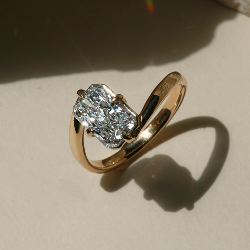 Yellow Gold Radiant cut overlap engagement ring with compass prongs