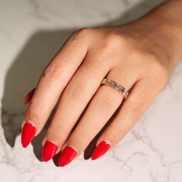Modern Bezel Set Emerald Cut Diamond Ring in 14 Karat Yellow Gold with 1.30 Carat of Diamonds