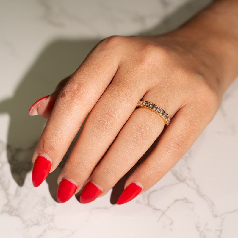 Modern Horizontal Bezel Set Emerald Cut Diamond Ring in 14 Karat Yellow Gold with .95 Carat of Diamonds