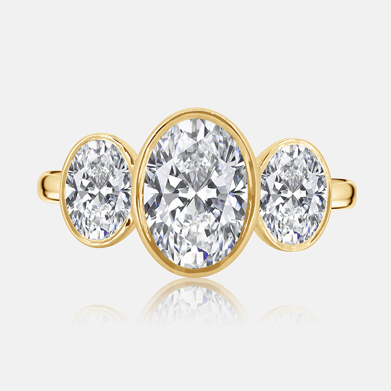 Three stone oval bezel engagement ring