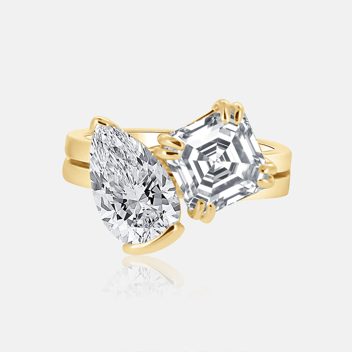 Toi et Moi engagement ring with asscher and pear shape diamond