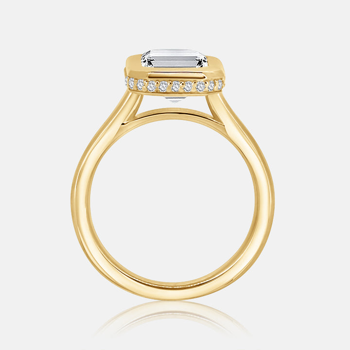 yellow gold hidden halo emerald cut bezel set engagement ring 