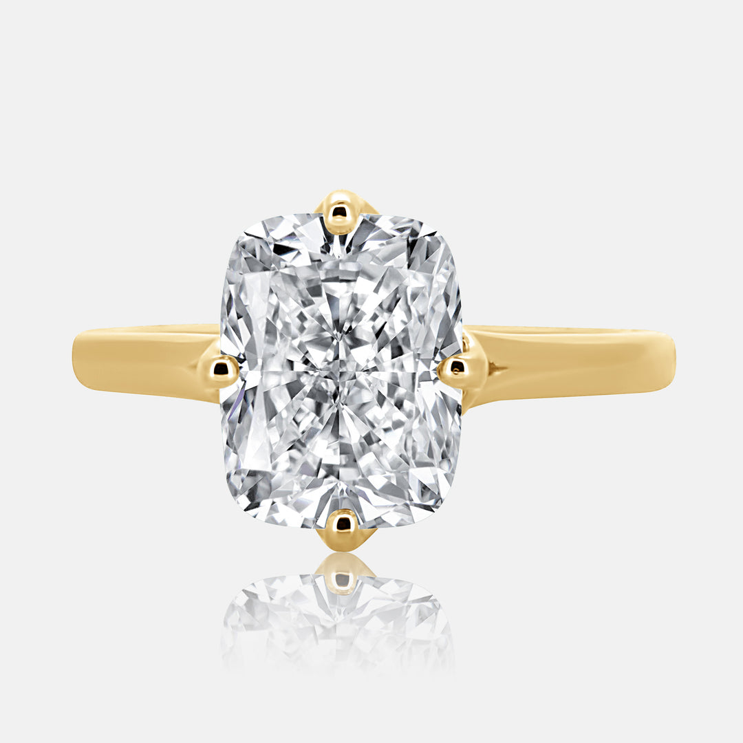 Elongated cushion cut solitaire engagement ring 