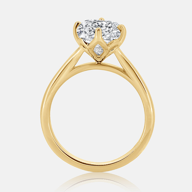 Elongated cushion cut cathedral engagement ring with petal head