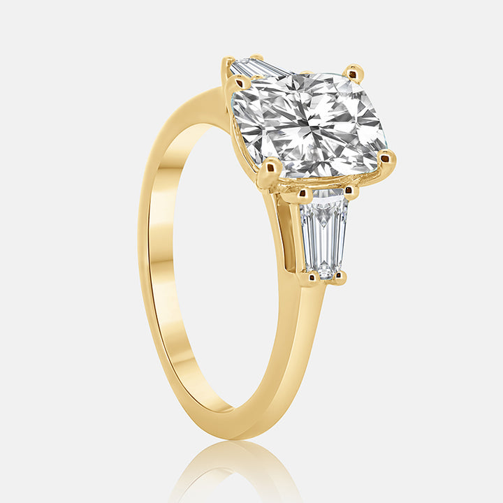 tapered baguette three stone engagement ring with a cushion cut diamond in the center