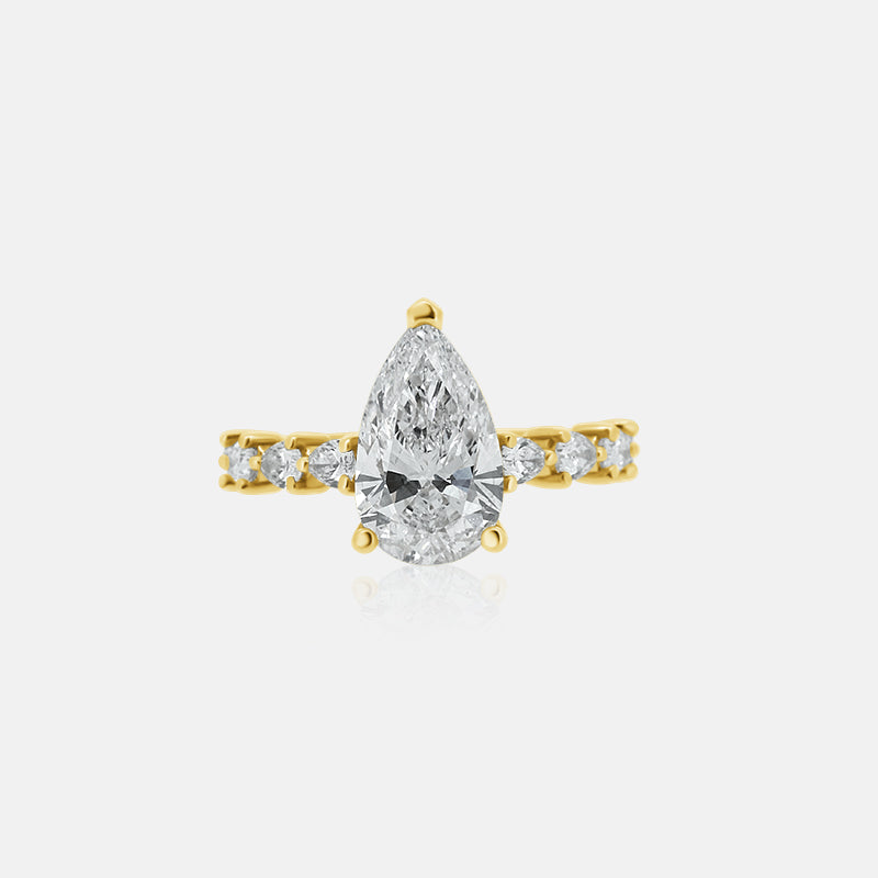 Pear shape engagement ring with pear shape diamonds in the band