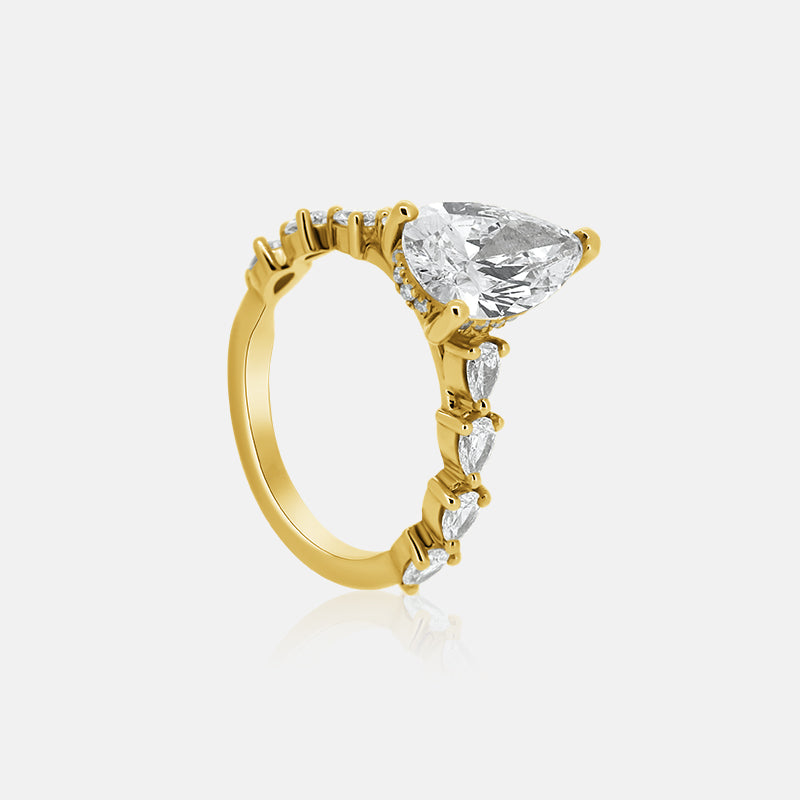 Pear shape engagement ring with pear shape diamonds in the band in yellow old