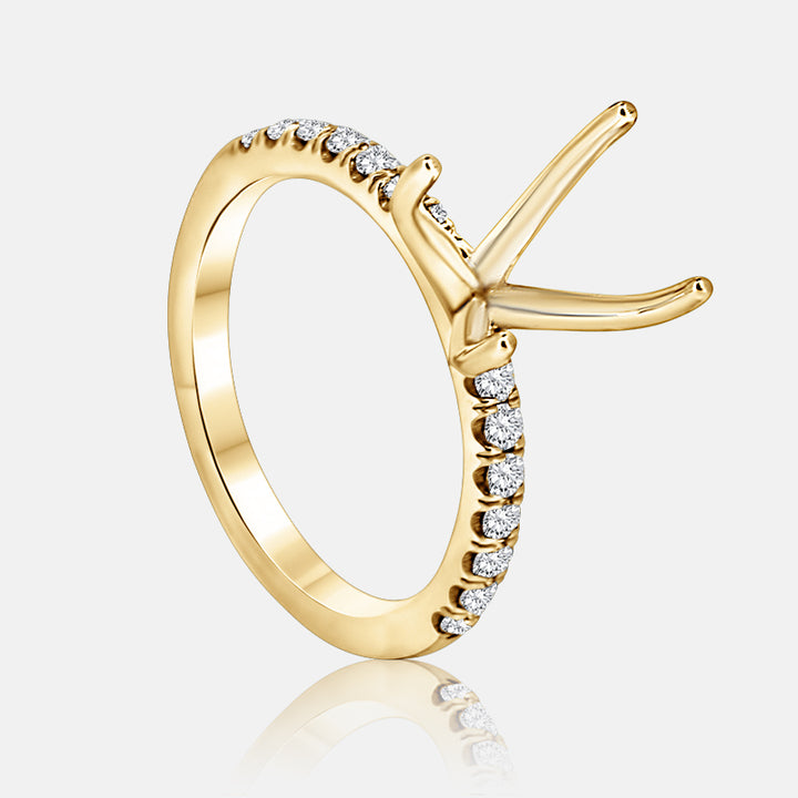 Solitaire Engagement Ring with .30 carats of pave round diamond in 14 Karat Yellow Gold