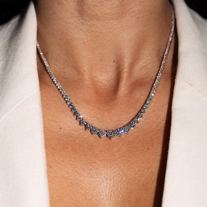 Graduating tennis necklace with 9.62 carats of round diamonds in 14 Karat White Gold