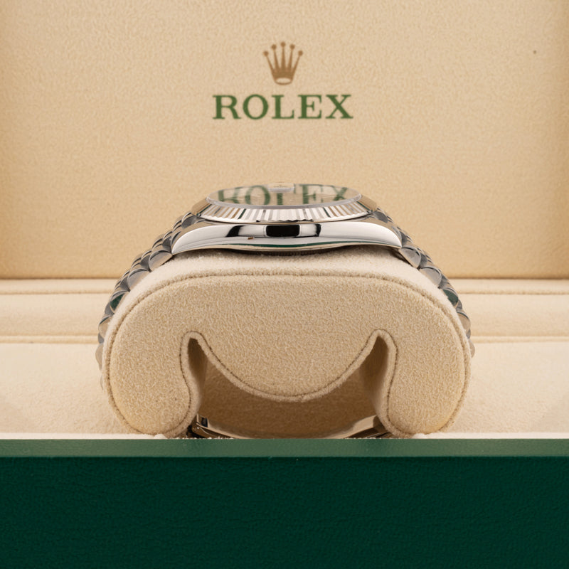 Rolex 126334 Blue Dial on a jubilee band displayed on it's side showing the watch case in a beige rolex box 