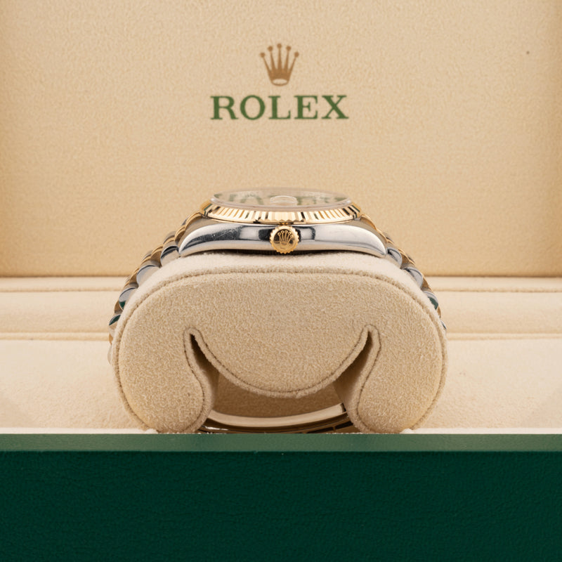 Rolex Datejust 116233 pyramid dial two tone watch jubilee band showing the winding crown in a beige rolex watch