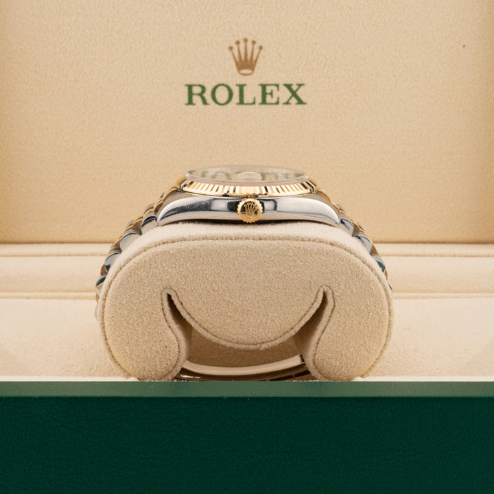 Rolex Datejust 116233 pyramid dial two tone watch jubilee band showing the winding crown in a beige rolex watch