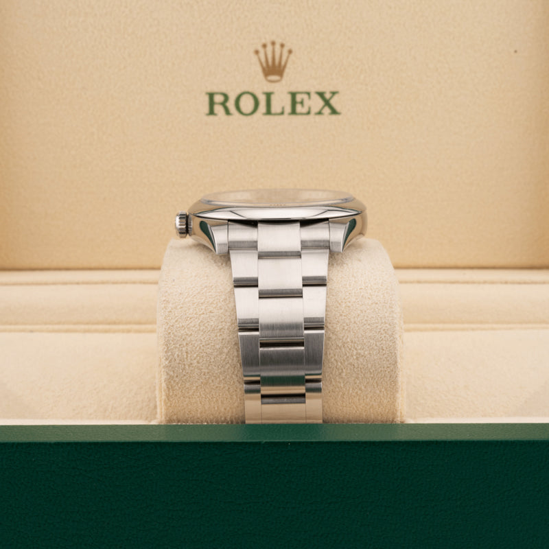 Rolex 124300 Green Dial Oyster perpetual   displaying in oyster band in a Rolex beige box 