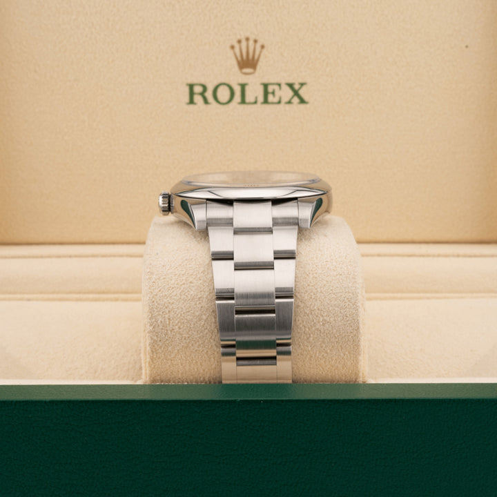 Rolex 124300 Green Dial Oyster perpetual   displaying in oyster band in a Rolex beige box 