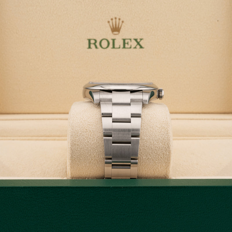 Rolex 124300 Green Dial Oyster perpetual   displaying the watch band in a Rolex beige box 