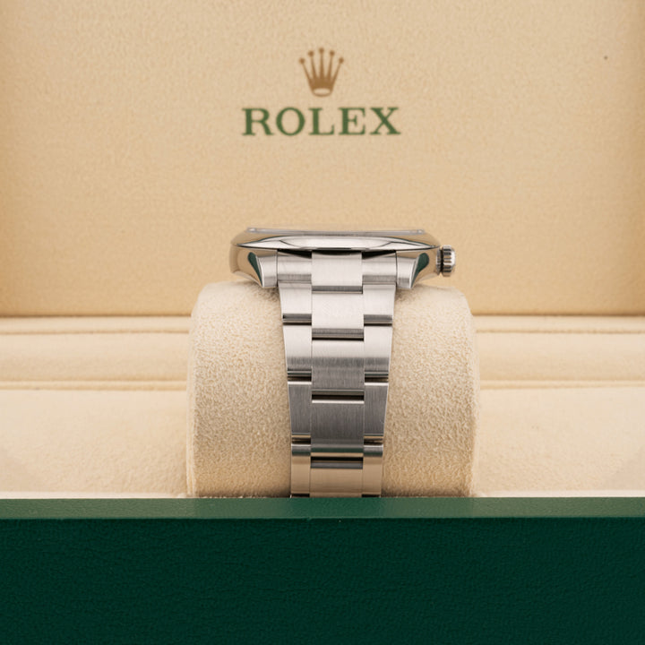Rolex 124300 Green Dial Oyster perpetual   displaying the watch band in a Rolex beige box 