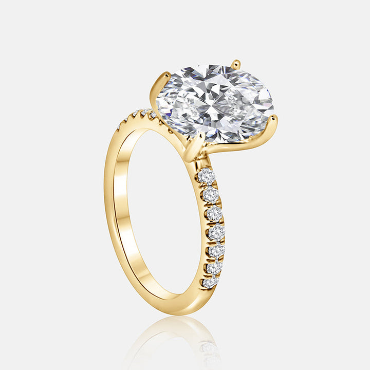 Solitaire Engagement Ring with .30 carats of pave round diamond in 14 Karat Yellow Gold