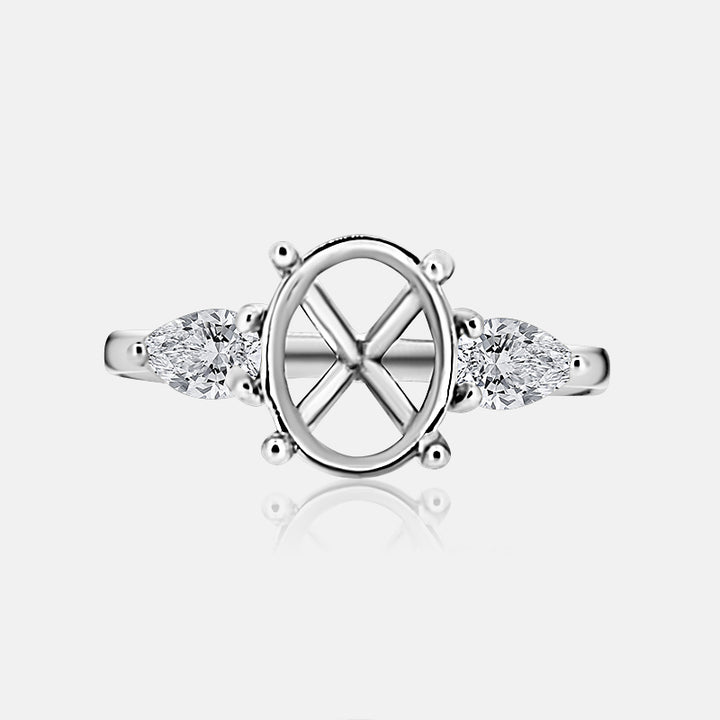 Three stone Engagement Ring with .52 carats of pear shape diamonds in 14 karat white gold