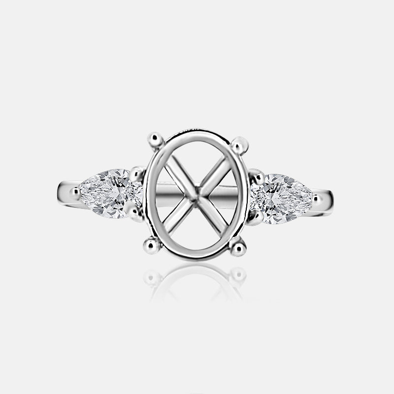 Three stone Engagement Ring with .52 carats of pear shape diamonds in 14 karat white gold