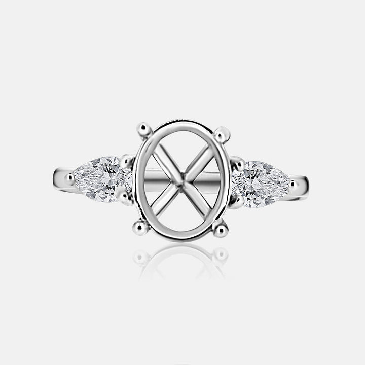 Three stone Engagement Ring with .52 carats of pear shape diamonds in 14 karat white gold